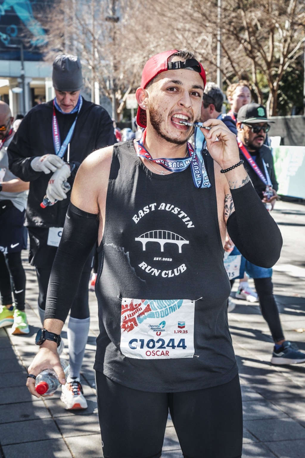 Oscar after finishing the Houston Marathon with his finisher medal